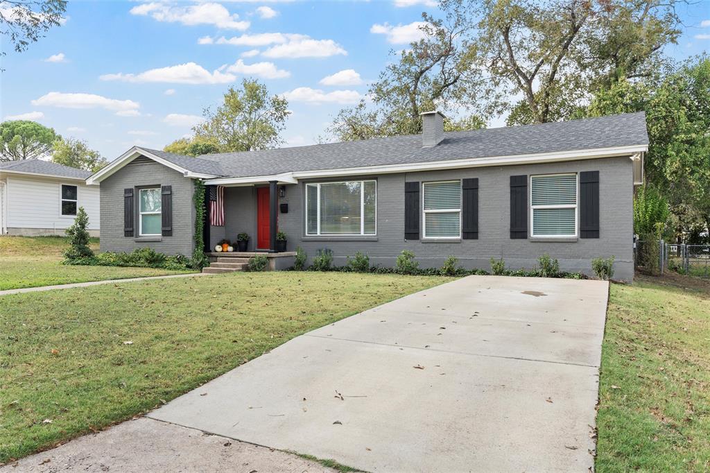 4229 Fort Avenue Waco, TX 76710 - Photo 38 of 40 a front view of a house with a yard and potted plants