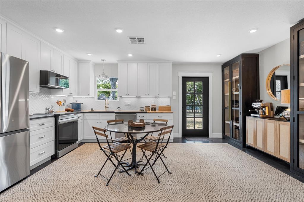 4229 Fort Avenue Waco, TX 76710 - Photo 10 of 40 a kitchen with stainless steel appliances a refrigerator stove microwave and sink