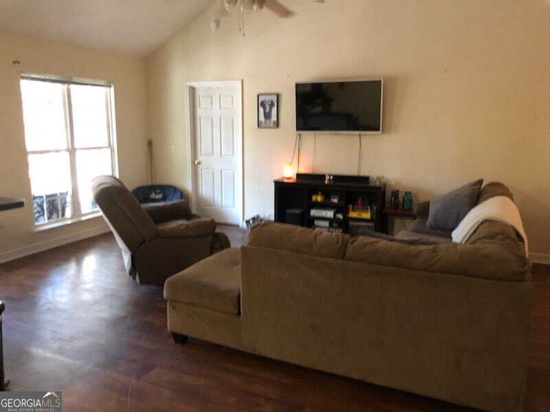 382 Langston Chapel Road Statesboro, GA 30458 - Photo 4 of 7 a living room with furniture and a flat screen tv
