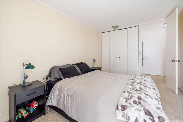 a bedroom with a bed and a tv in it