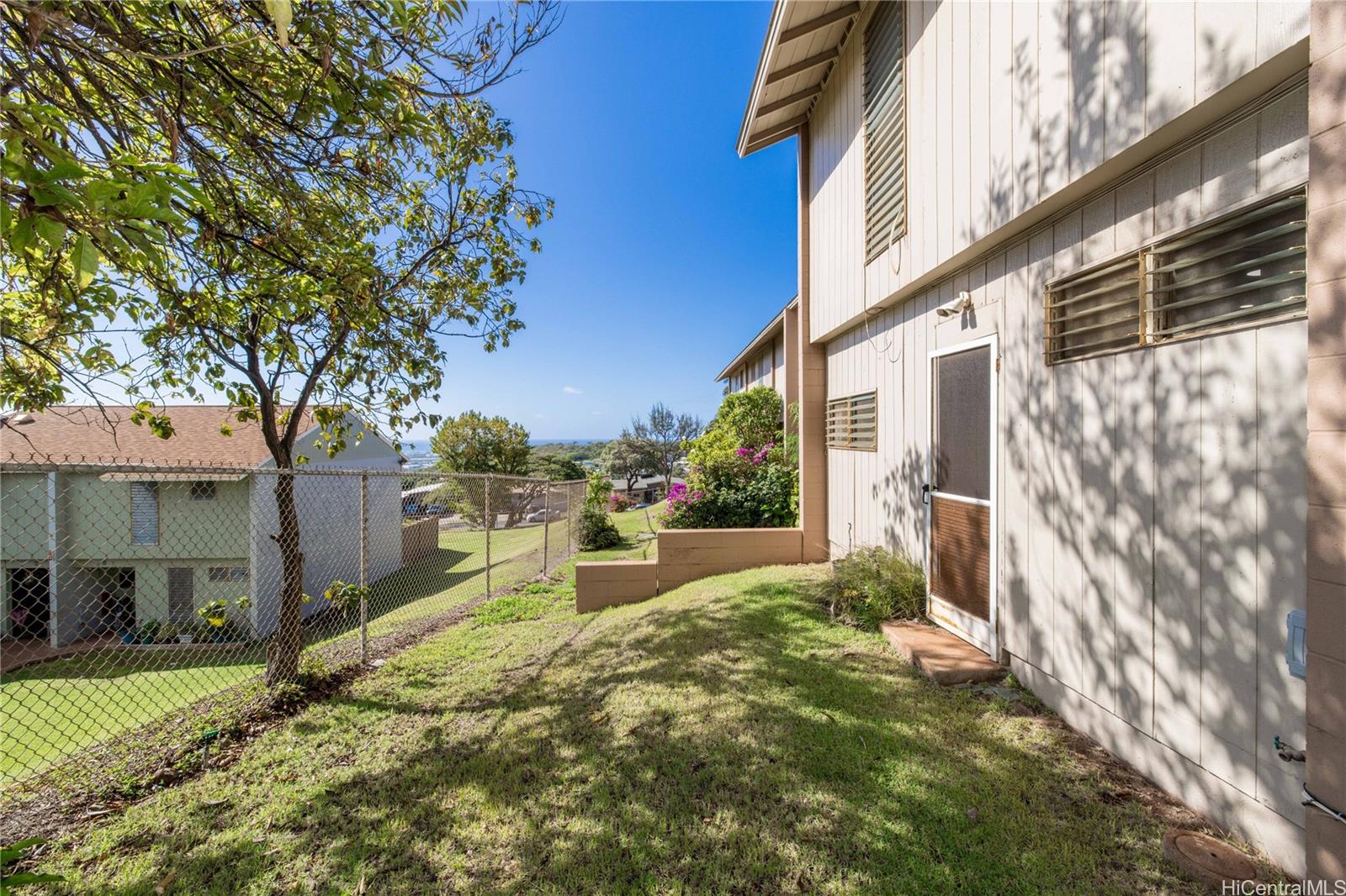 92-739 Makakilo Drive, Unit 21 Kapolei, HI 96707 - Photo 21 of 25 a view of a house with a yard and pathway