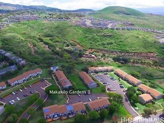 an aerial view of residential houses and outdoor space
