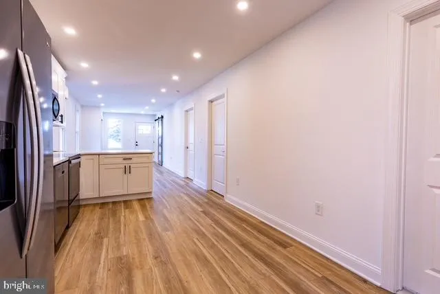 a view of a kitchen with wooden floor