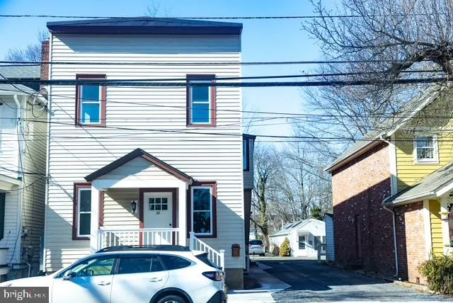 a front view of a house with parking