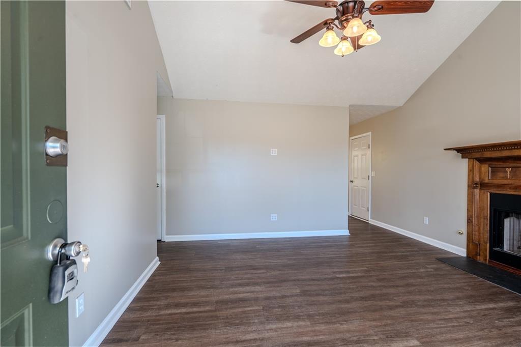 32 Chelsea Lane Grantville, GA 30220 - Photo 2 of 16 wooden floor in an empty room with a window