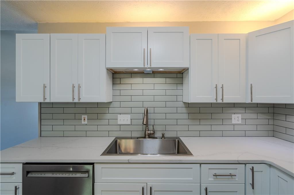 32 Chelsea Lane Grantville, GA 30220 - Photo 5 of 16 a kitchen with a sink and cabinets