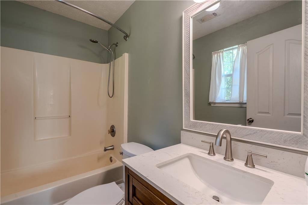 32 Chelsea Lane Grantville, GA 30220 - Photo 10 of 16 a bathroom with a sink and a mirror
