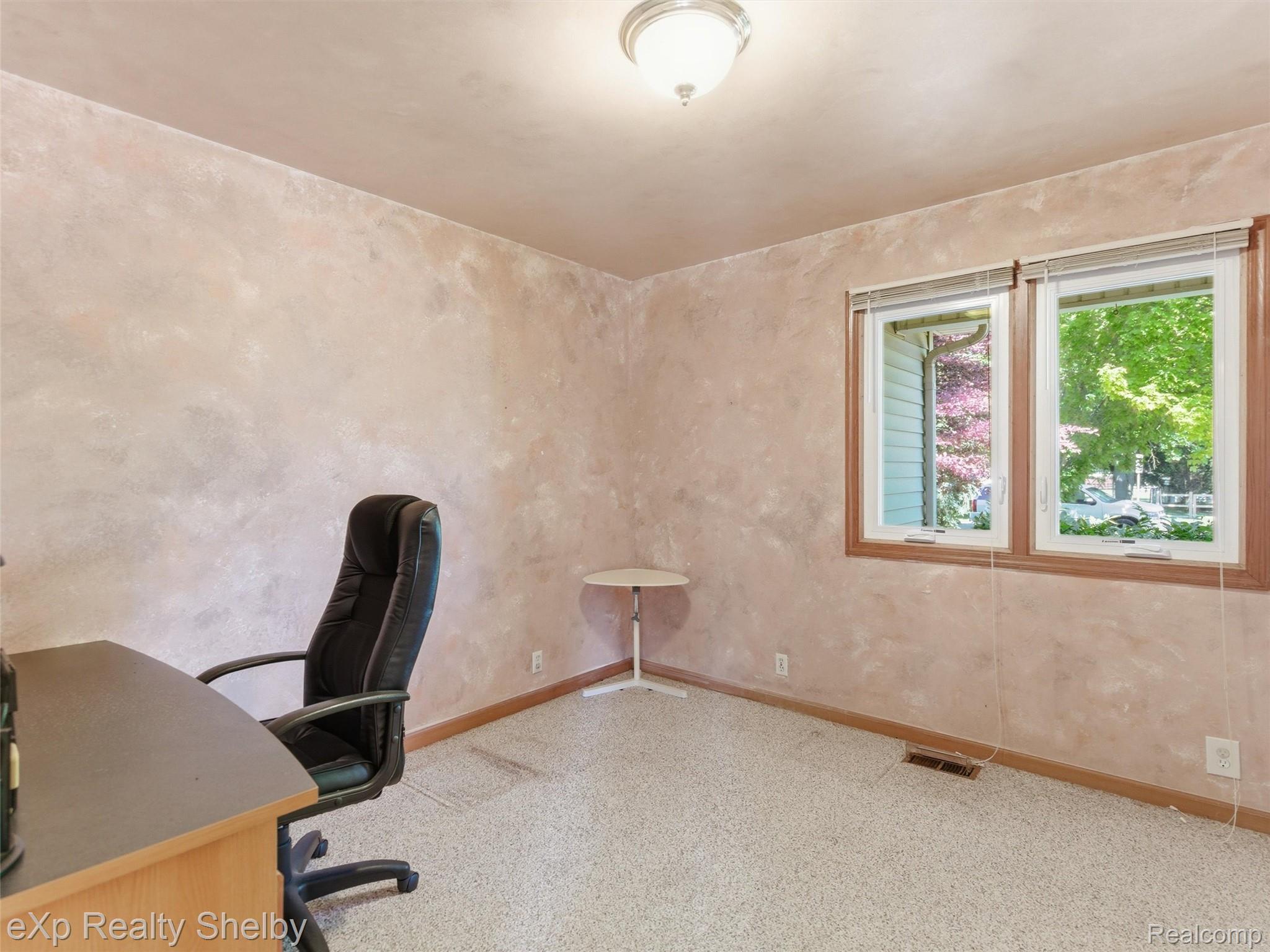 4154 Union Street Dryden, MI 48428 - Photo 16 of 41 Room featuring textured wall finish, double window with wood trim, carpet flooring, baseboards, and a semi-flush mount ceiling light fixture