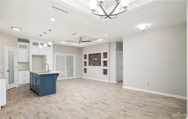 a kitchen with a sink and cabinets