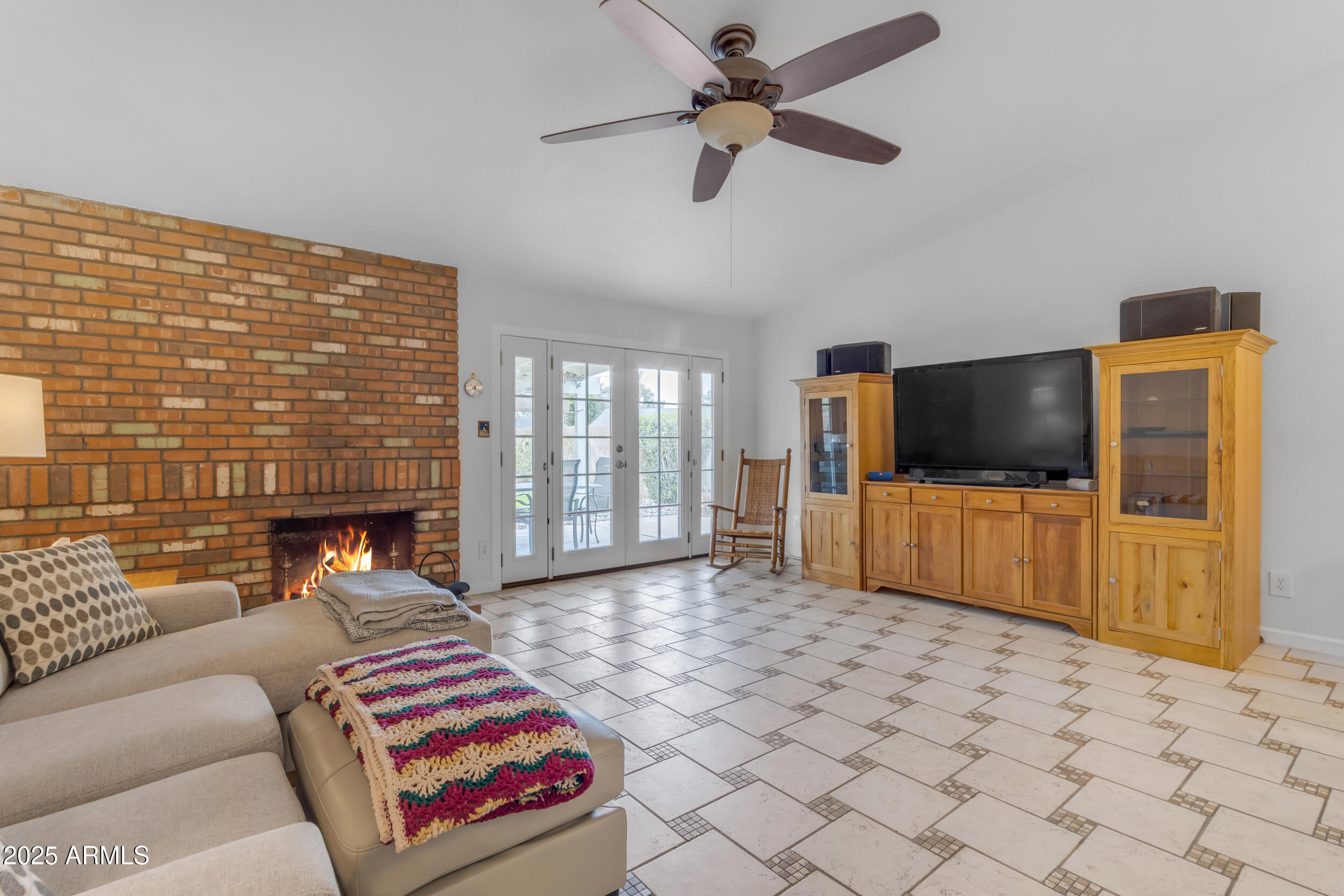 5165 East Tunder Drive Phoenix, AZ 85044 - Photo 11 of 44 a living room with furniture and a flat screen tv