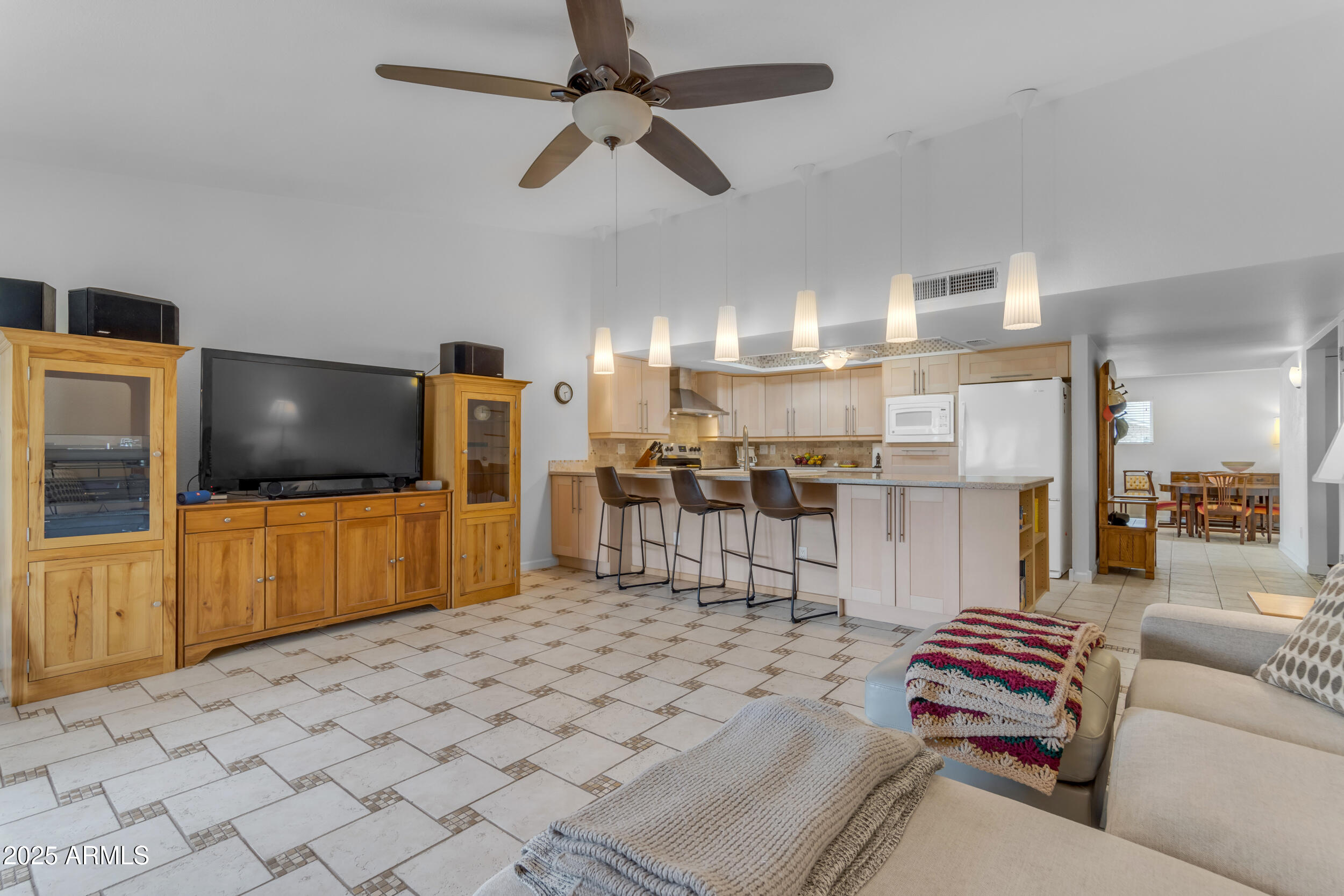 5165 East Tunder Drive Phoenix, AZ 85044 - Photo 15 of 44 a living room with furniture and a flat screen tv