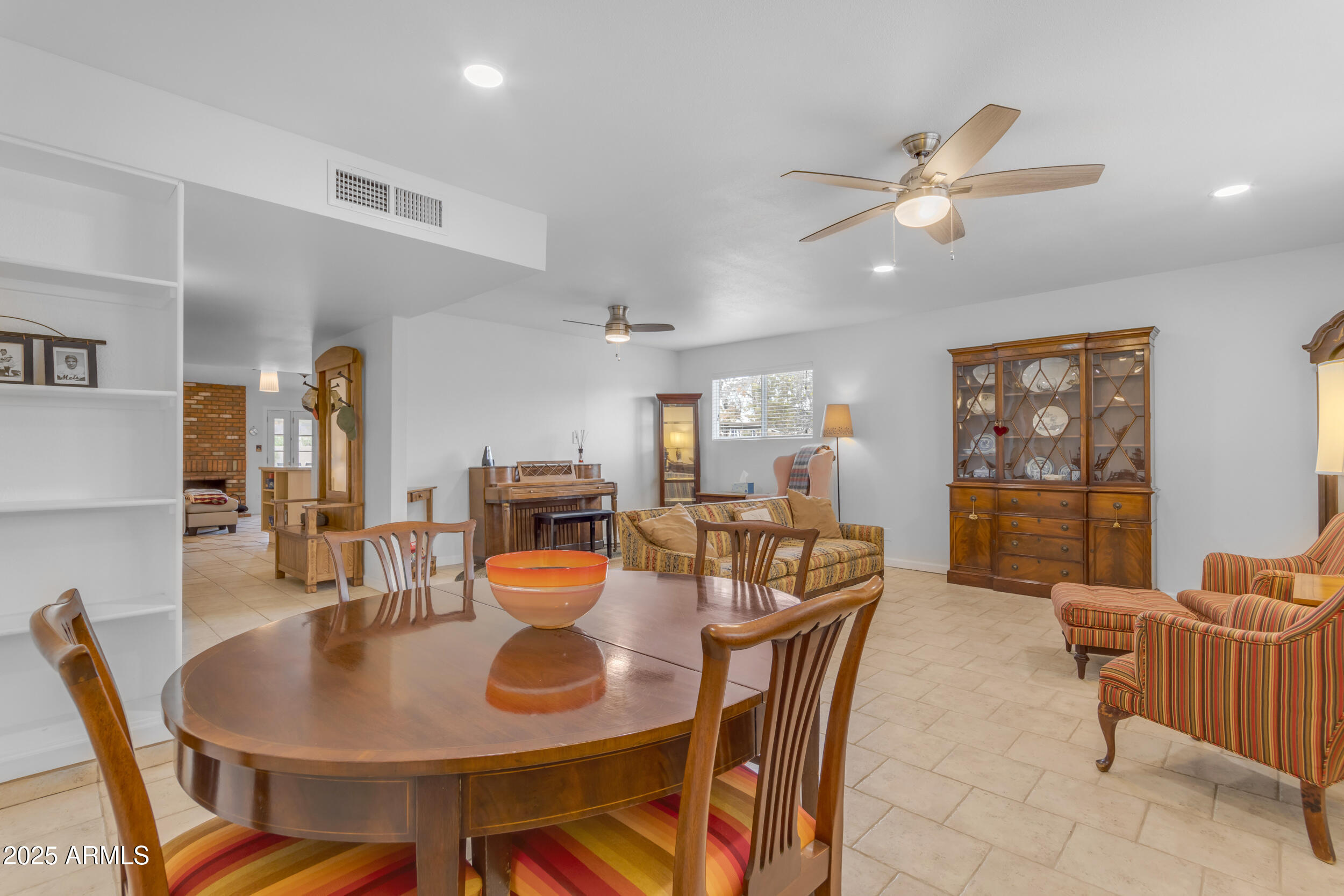 5165 East Tunder Drive Phoenix, AZ 85044 - Photo 18 of 44 a view of a dining room with furniture and chandelier