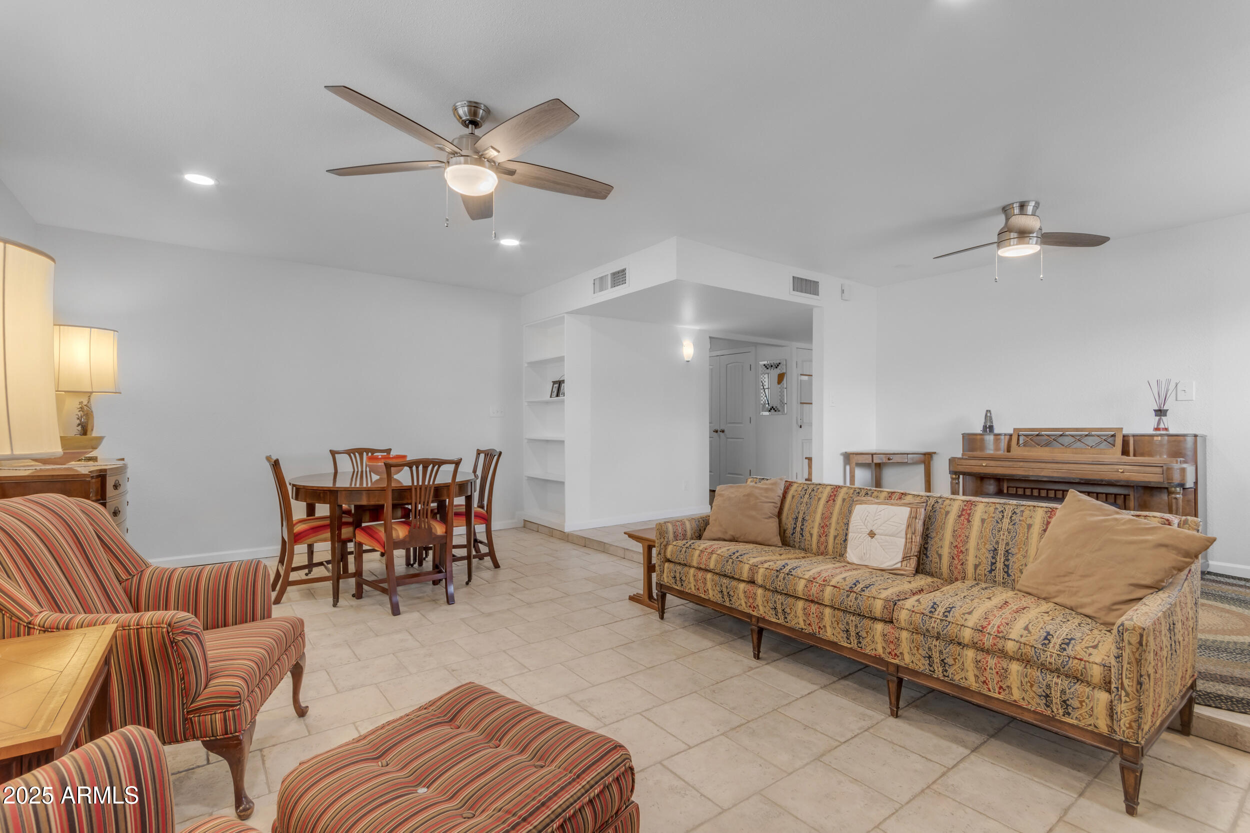 5165 East Tunder Drive Phoenix, AZ 85044 - Photo 19 of 44 a living room with furniture and kitchen view