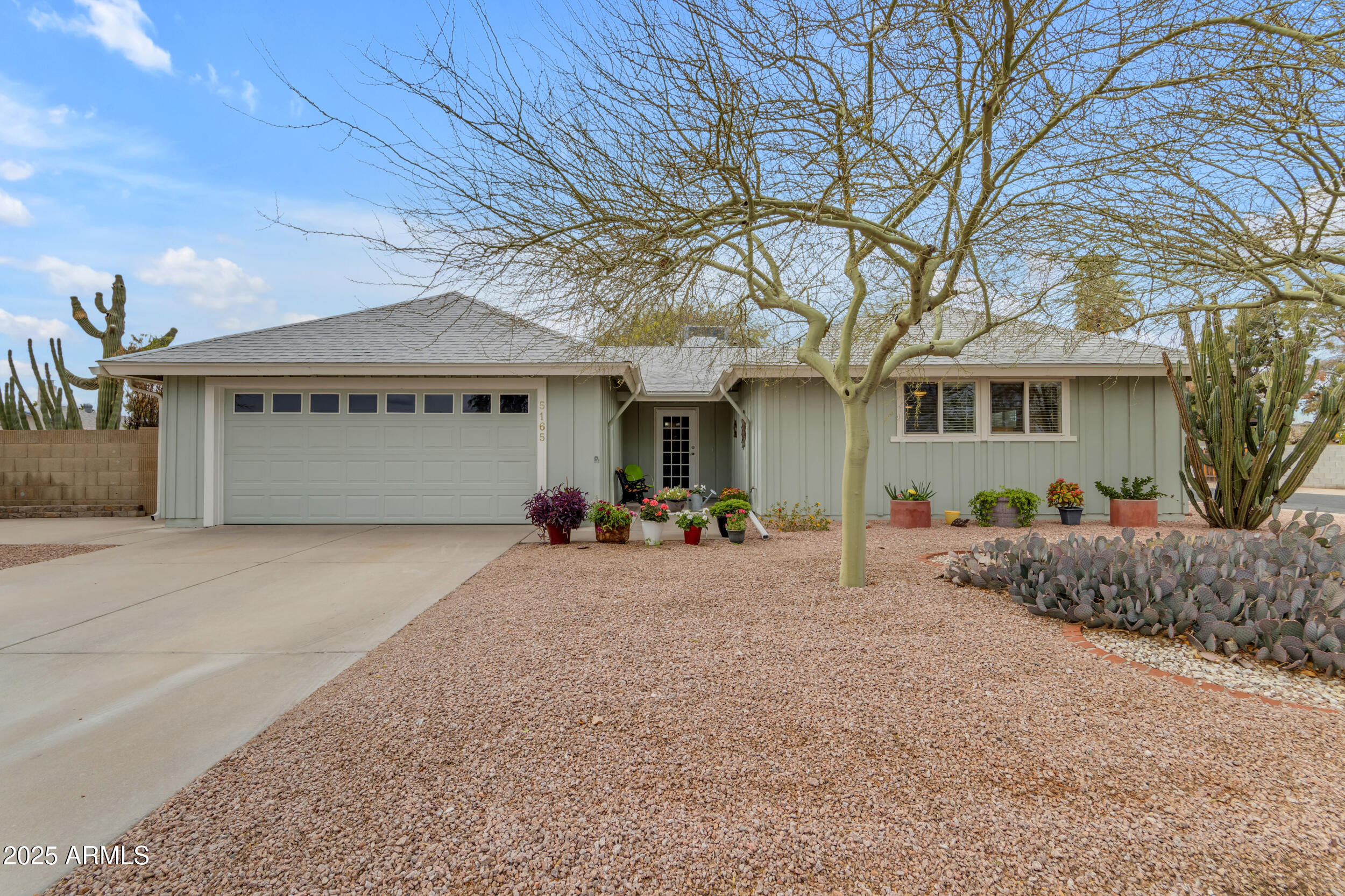 5165 East Tunder Drive Phoenix, AZ 85044 - Photo 2 of 44 front view of a house with a street