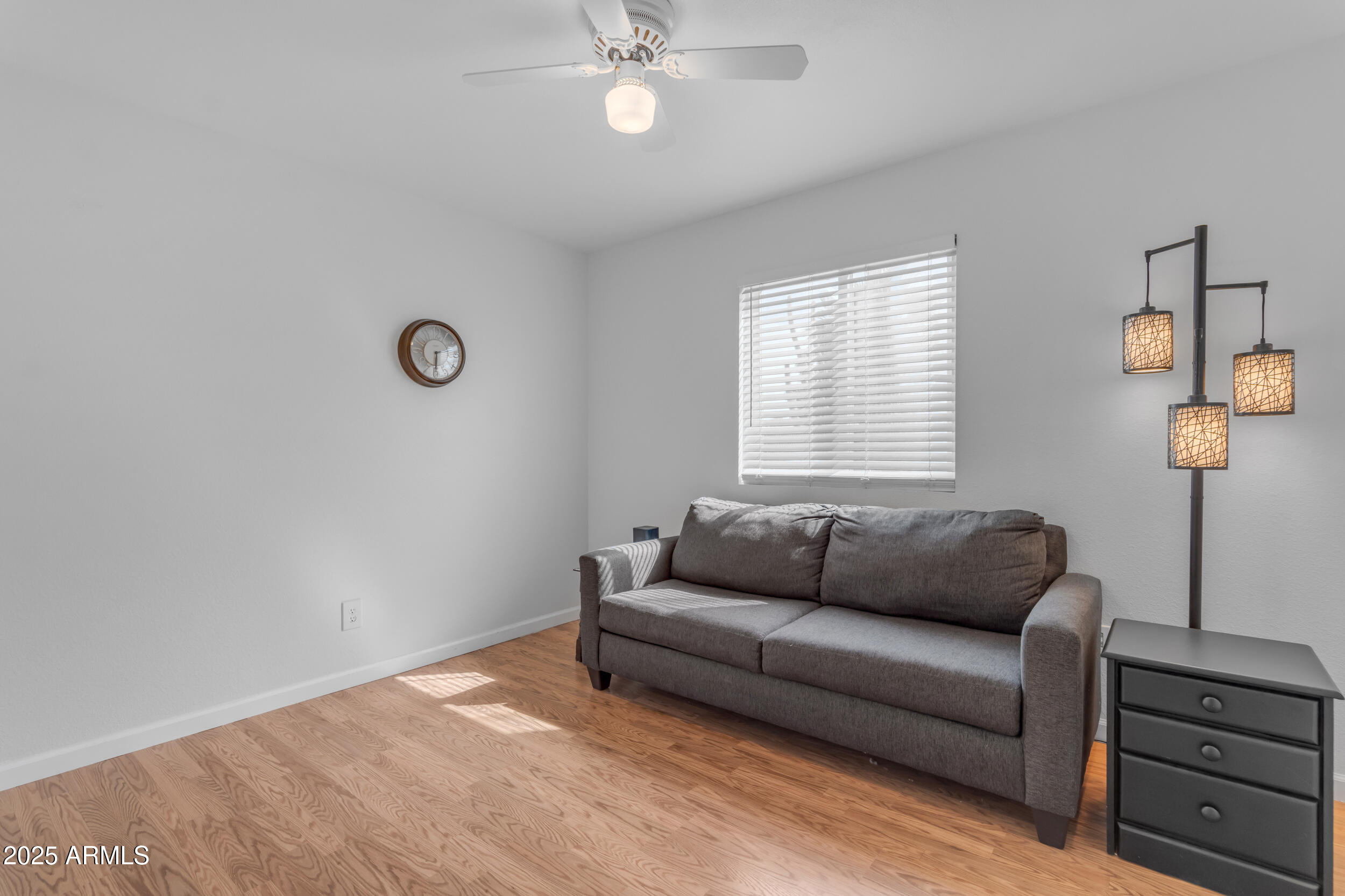 5165 East Tunder Drive Phoenix, AZ 85044 - Photo 21 of 44 a living room with furniture and a window