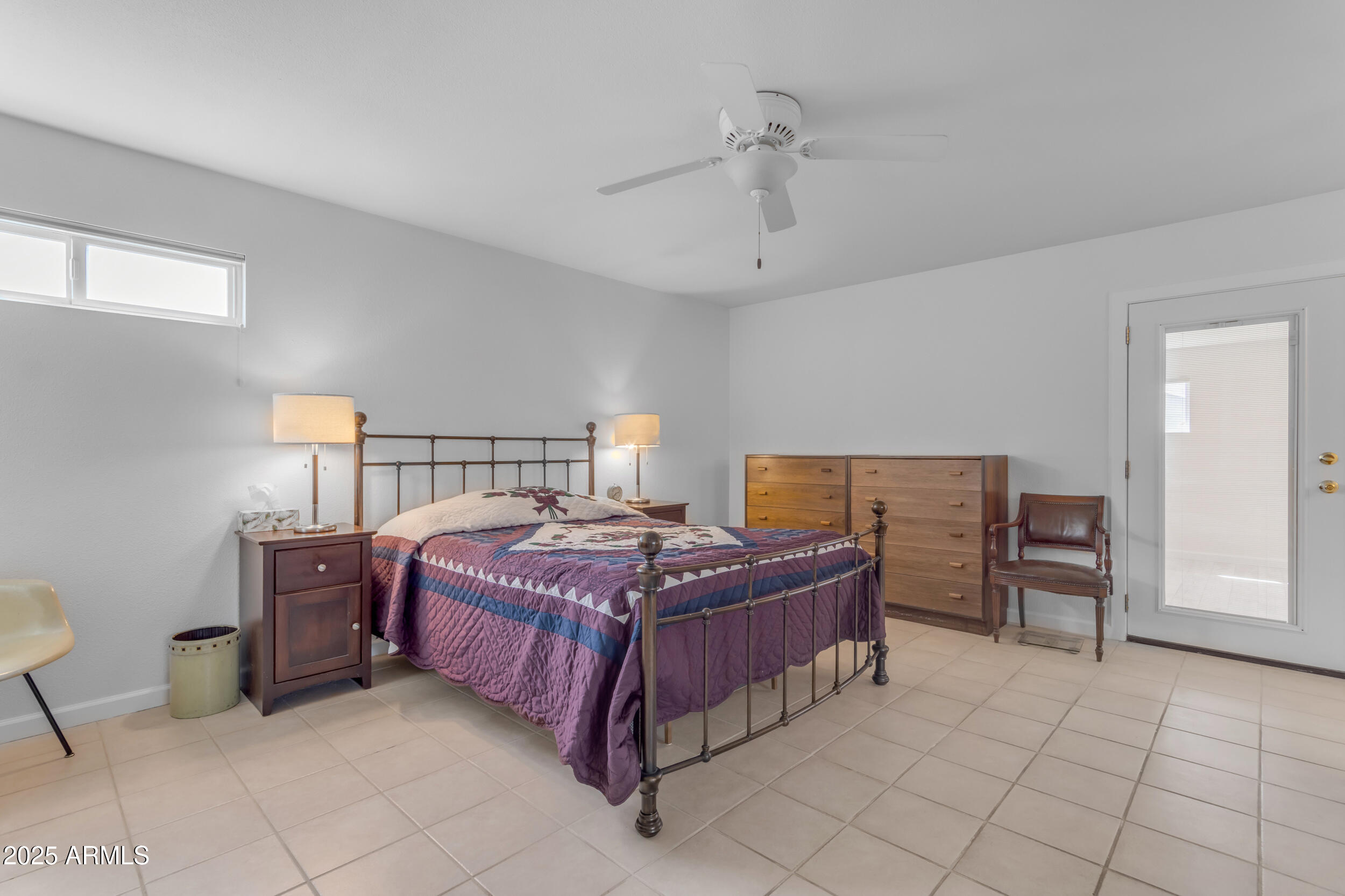5165 East Tunder Drive Phoenix, AZ 85044 - Photo 23 of 44 a bedroom with a bed and cabinets