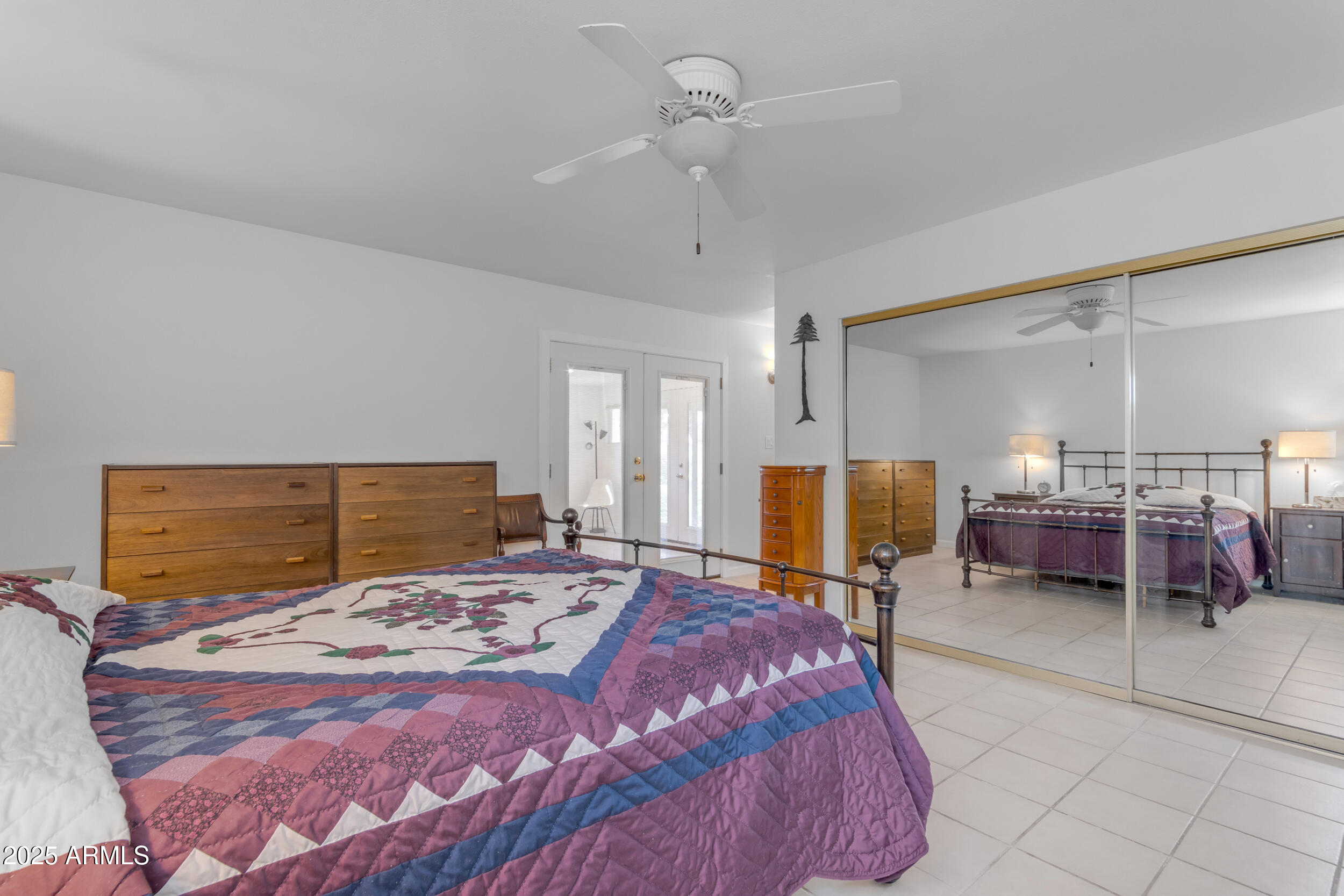 5165 East Tunder Drive Phoenix, AZ 85044 - Photo 24 of 44 a bedroom with a bed and a table in it