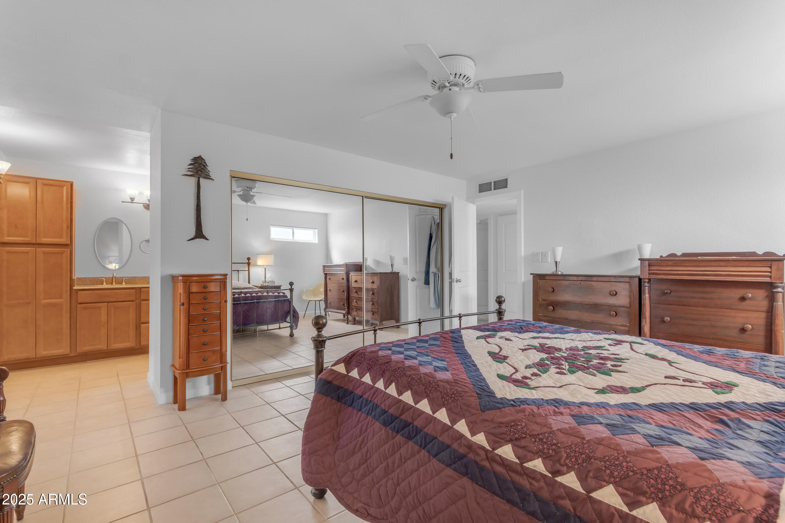 5165 East Tunder Drive Phoenix, AZ 85044 - Photo 25 of 44 a bed room with a bed and furniture