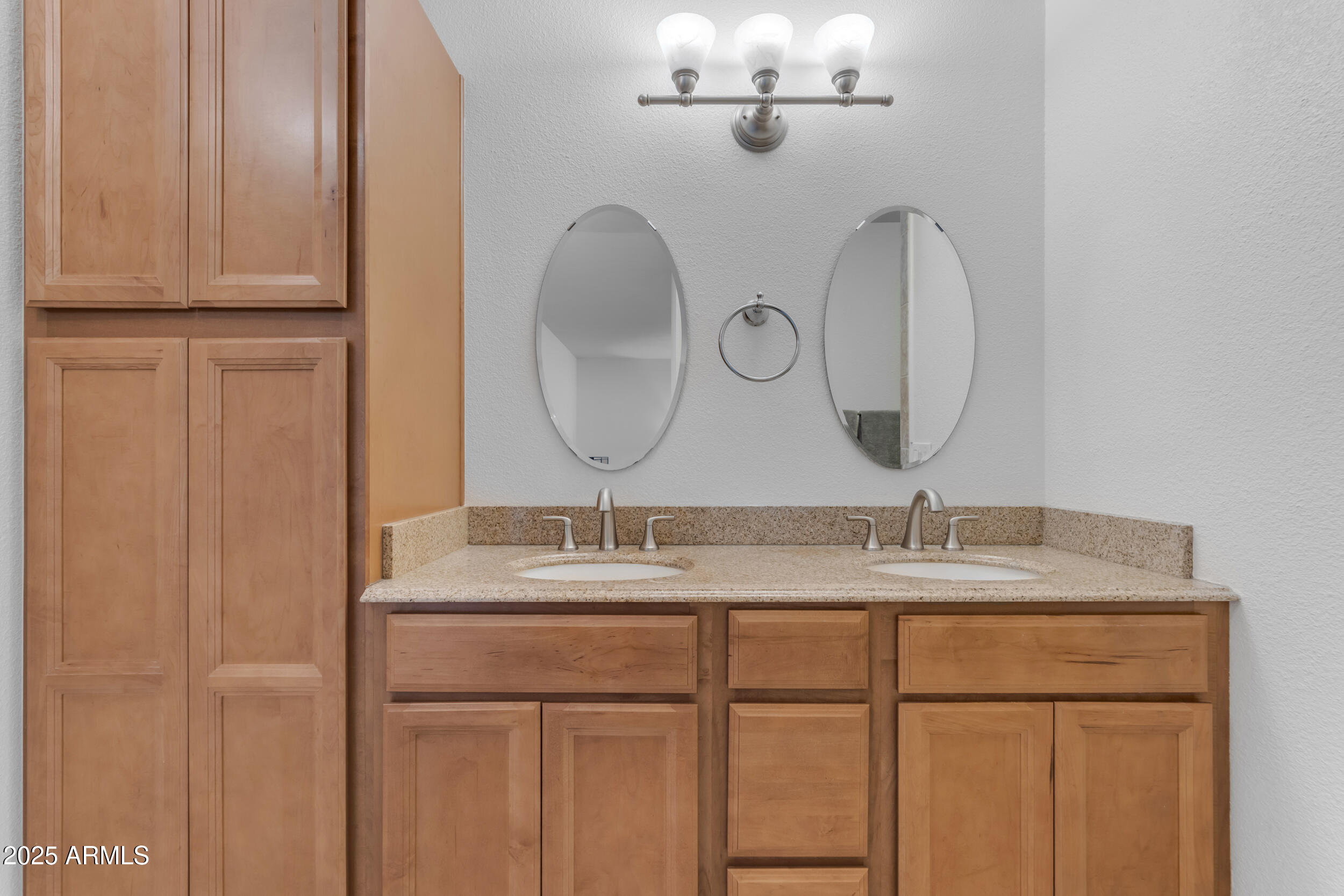 5165 East Tunder Drive Phoenix, AZ 85044 - Photo 27 of 44 a bathroom with a double vanity sink and a mirror