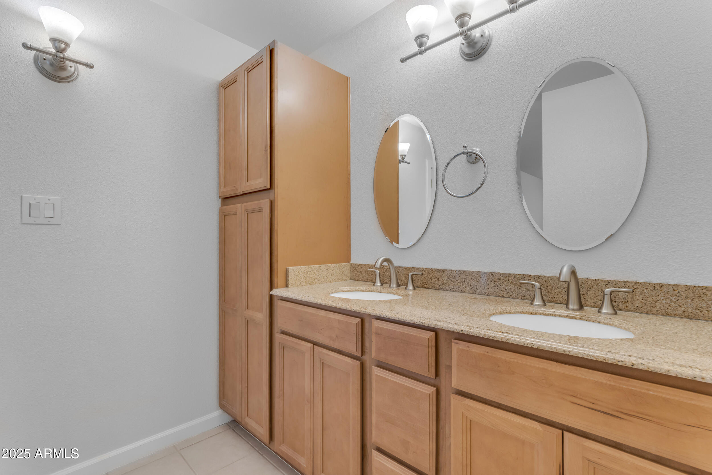5165 East Tunder Drive Phoenix, AZ 85044 - Photo 28 of 44 a bathroom with a double vanity sink and a mirror