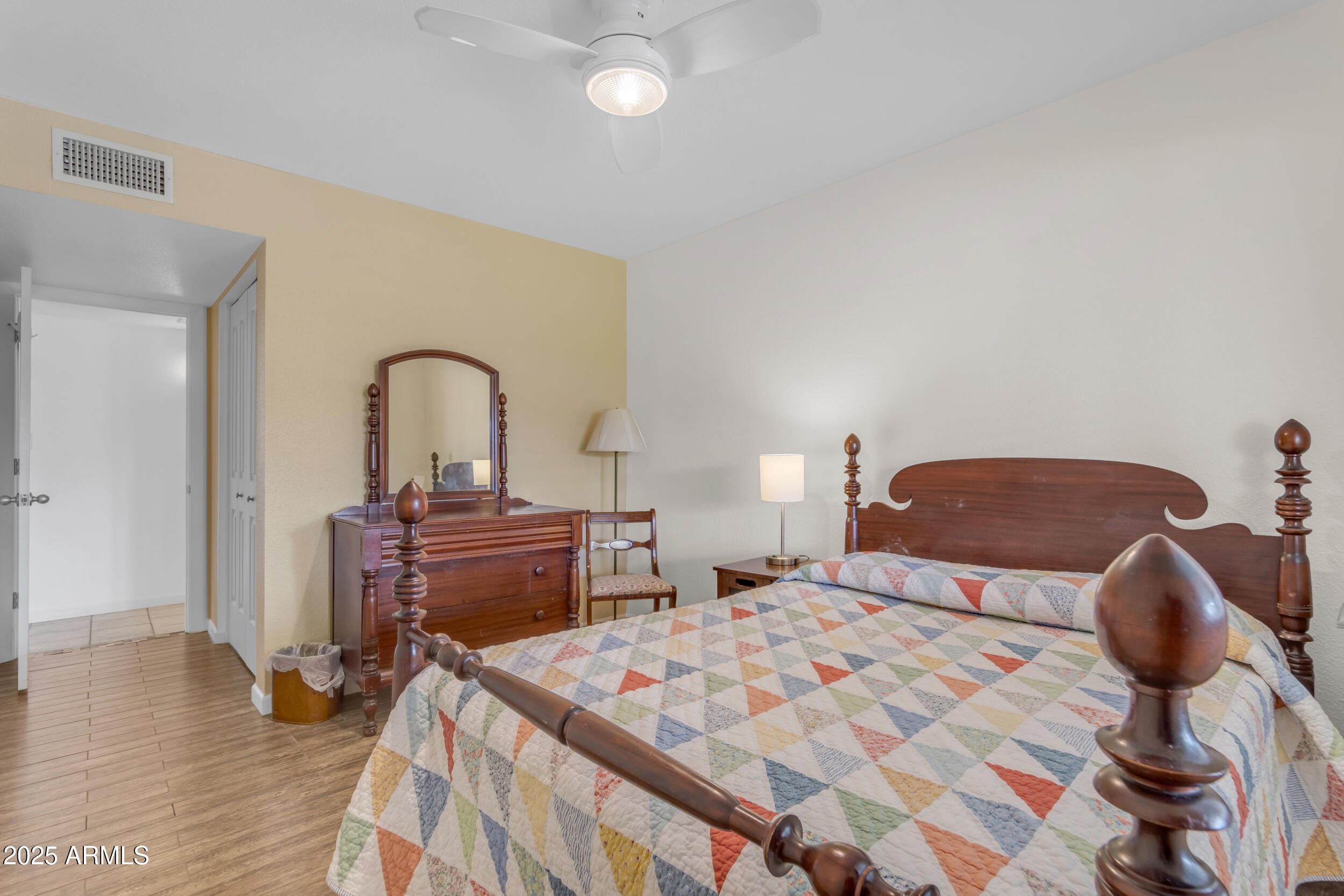 5165 East Tunder Drive Phoenix, AZ 85044 - Photo 34 of 44 a bedroom with a bed and wooden floor