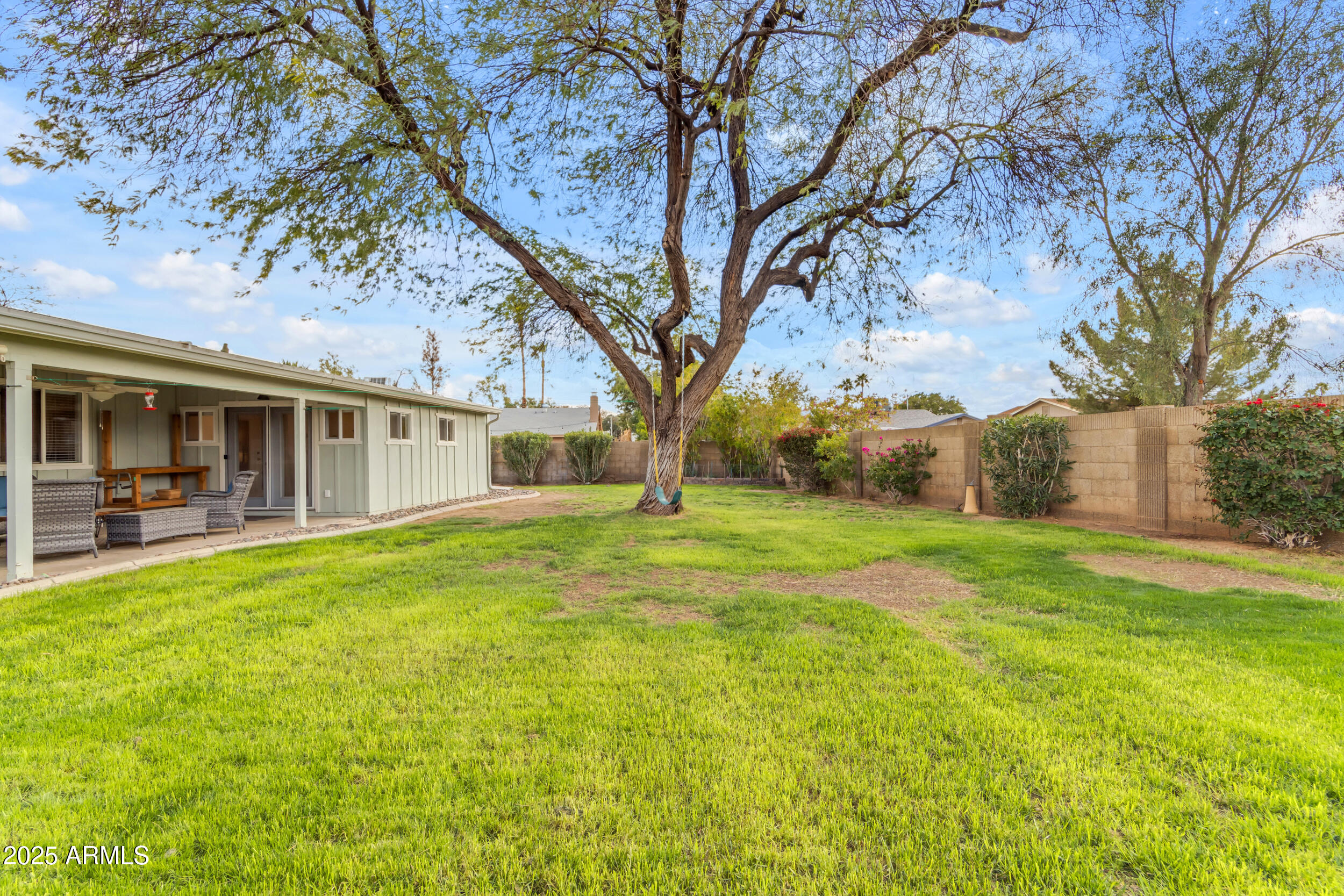 5165 East Tunder Drive Phoenix, AZ 85044 - Photo 39 of 44 a backyard of a house with table and chairs