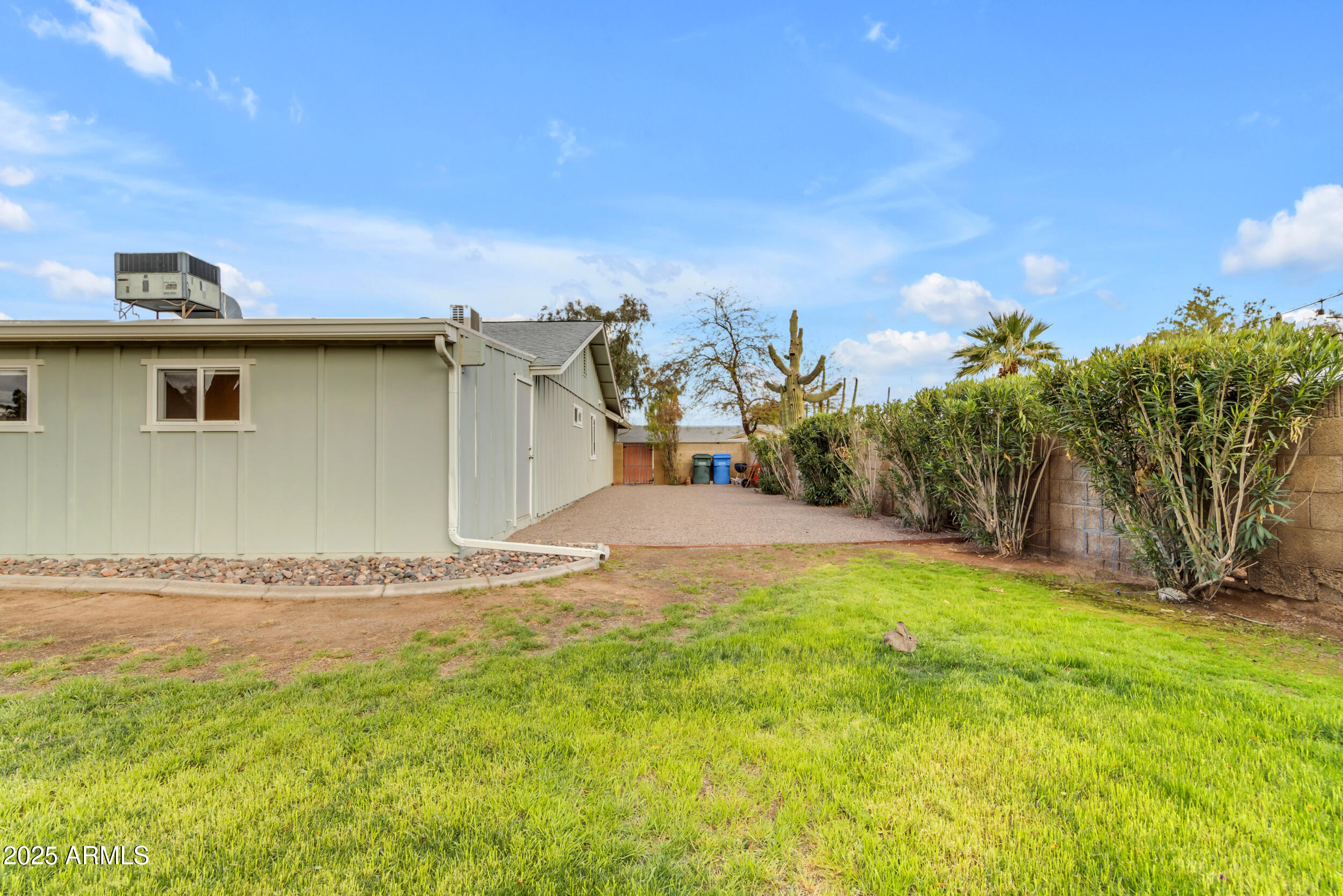 5165 East Tunder Drive Phoenix, AZ 85044 - Photo 43 of 44 a view of a dry yard with wooden fence