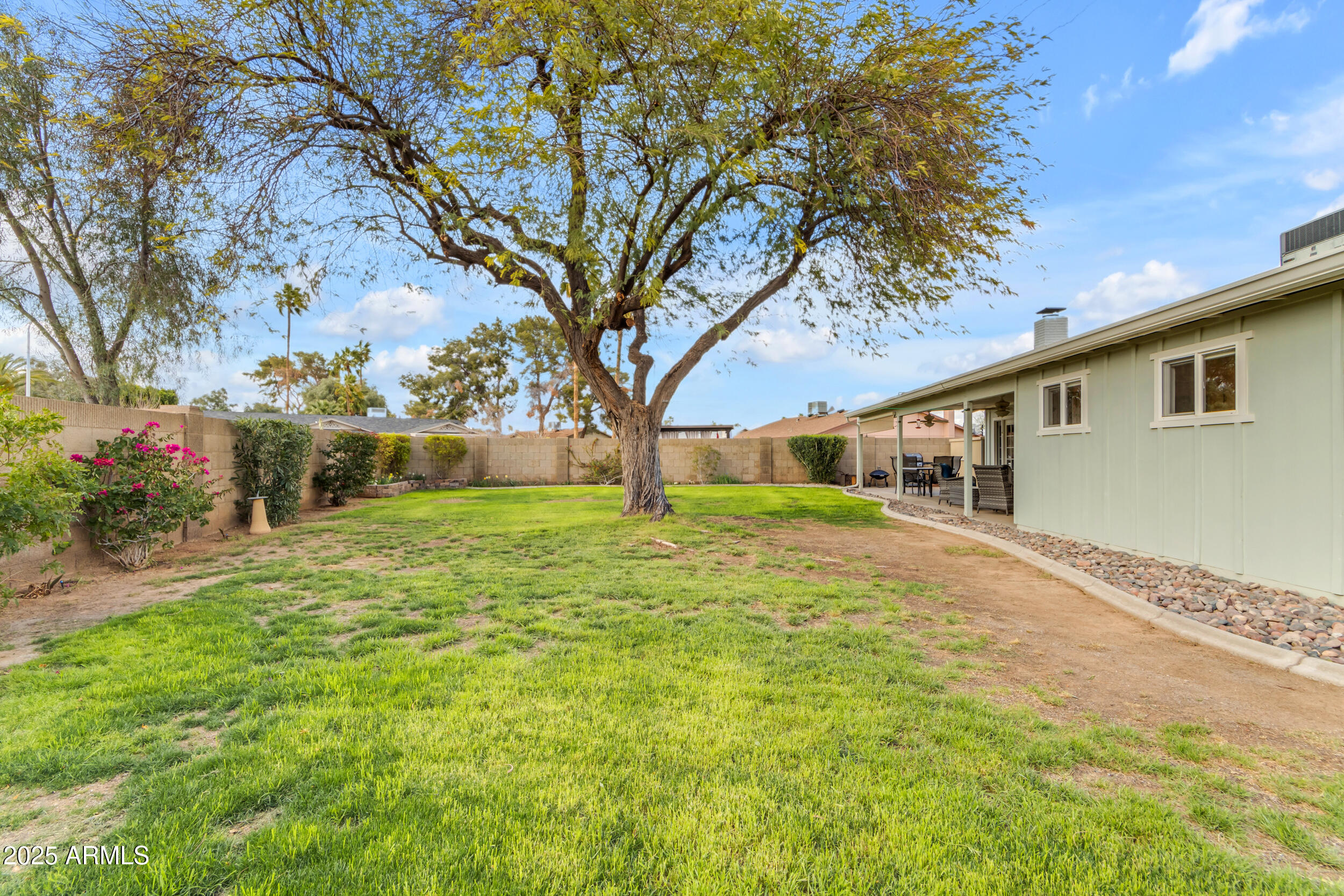 5165 East Tunder Drive Phoenix, AZ 85044 - Photo 44 of 44 a front view of a house with a yard garage and outdoor seating
