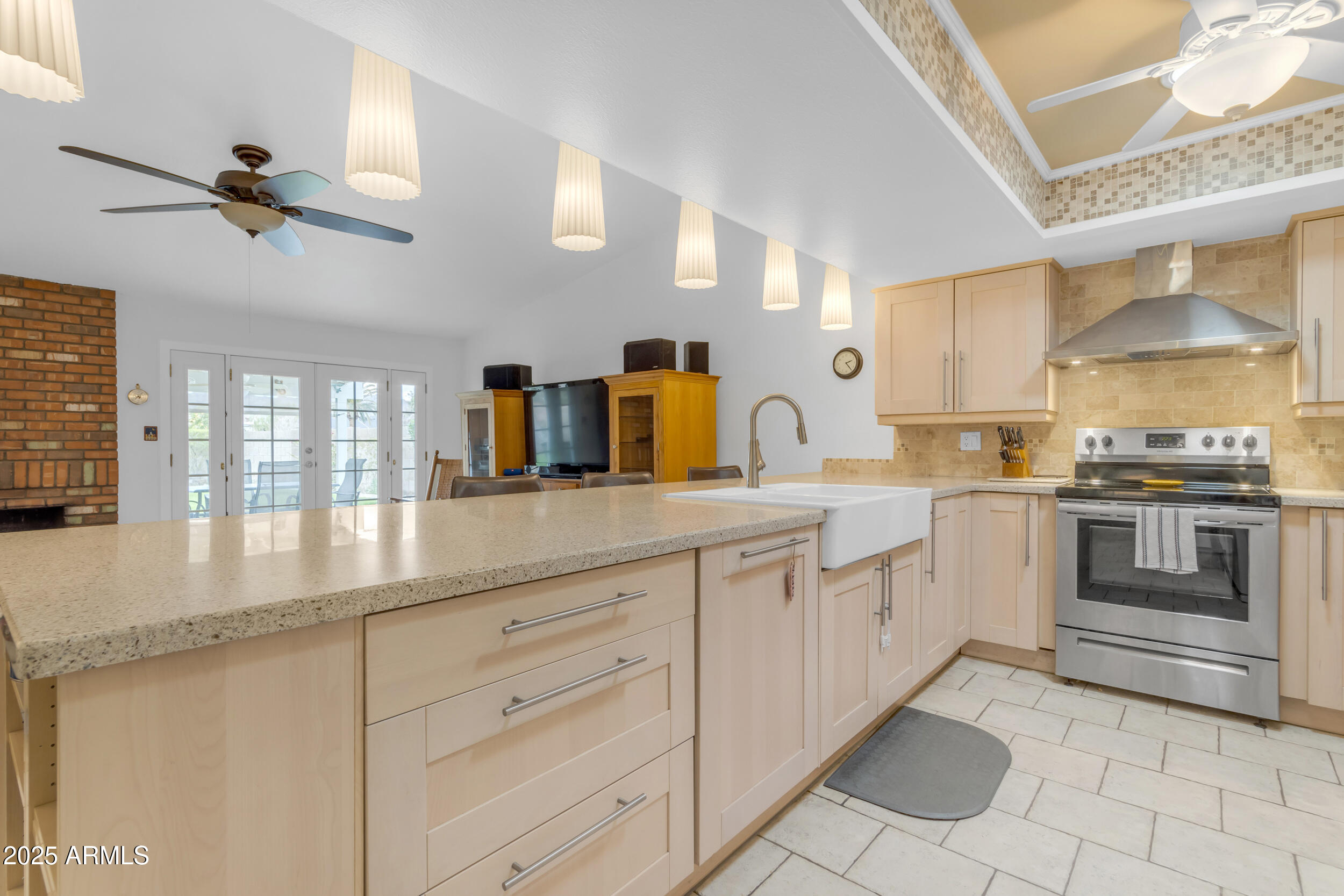 5165 East Tunder Drive Phoenix, AZ 85044 - Photo 9 of 44 a kitchen with granite countertop a sink stainless steel appliances and cabinets