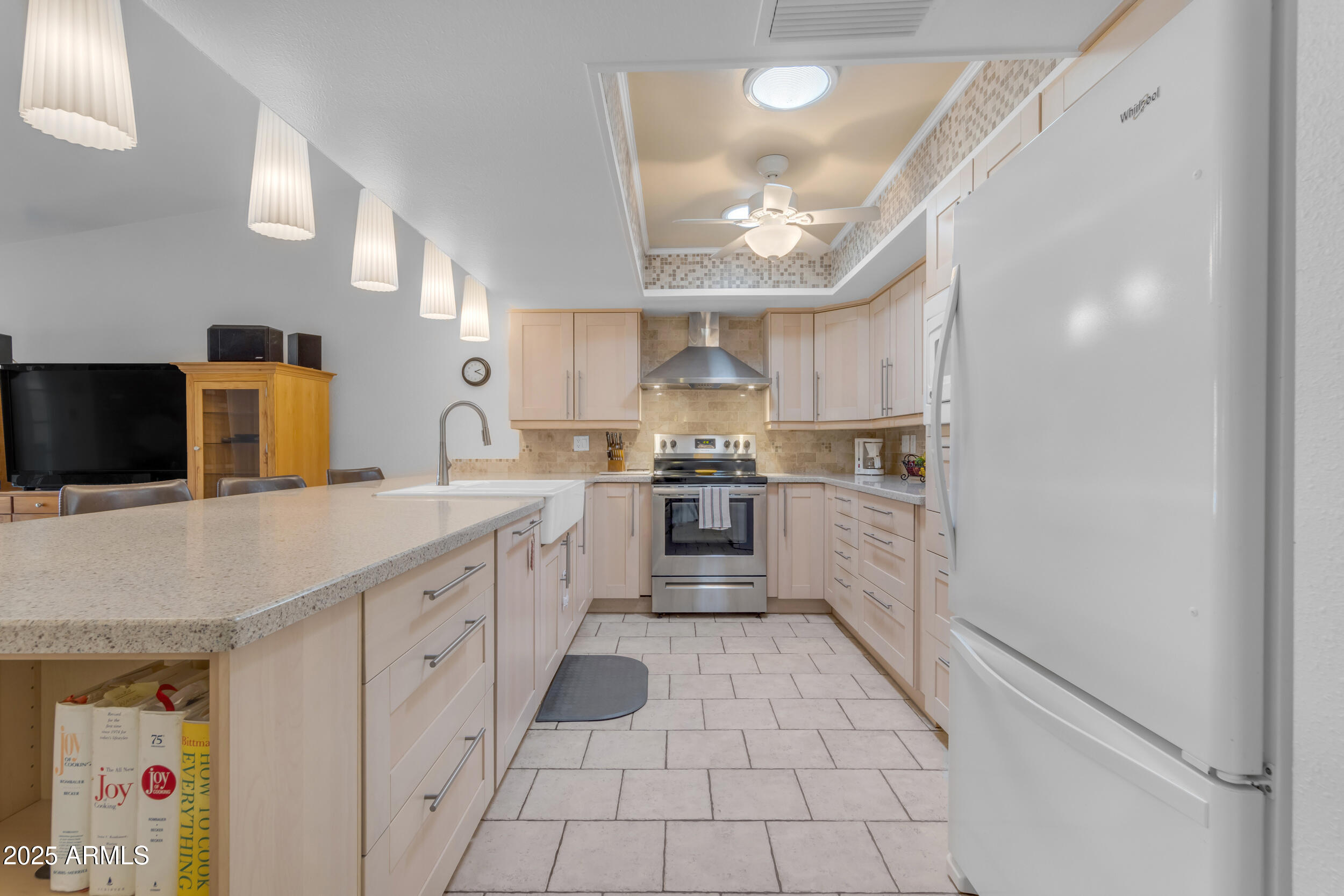 5165 East Tunder Drive Phoenix, AZ 85044 - Photo 10 of 44 a kitchen with white cabinets and appliances