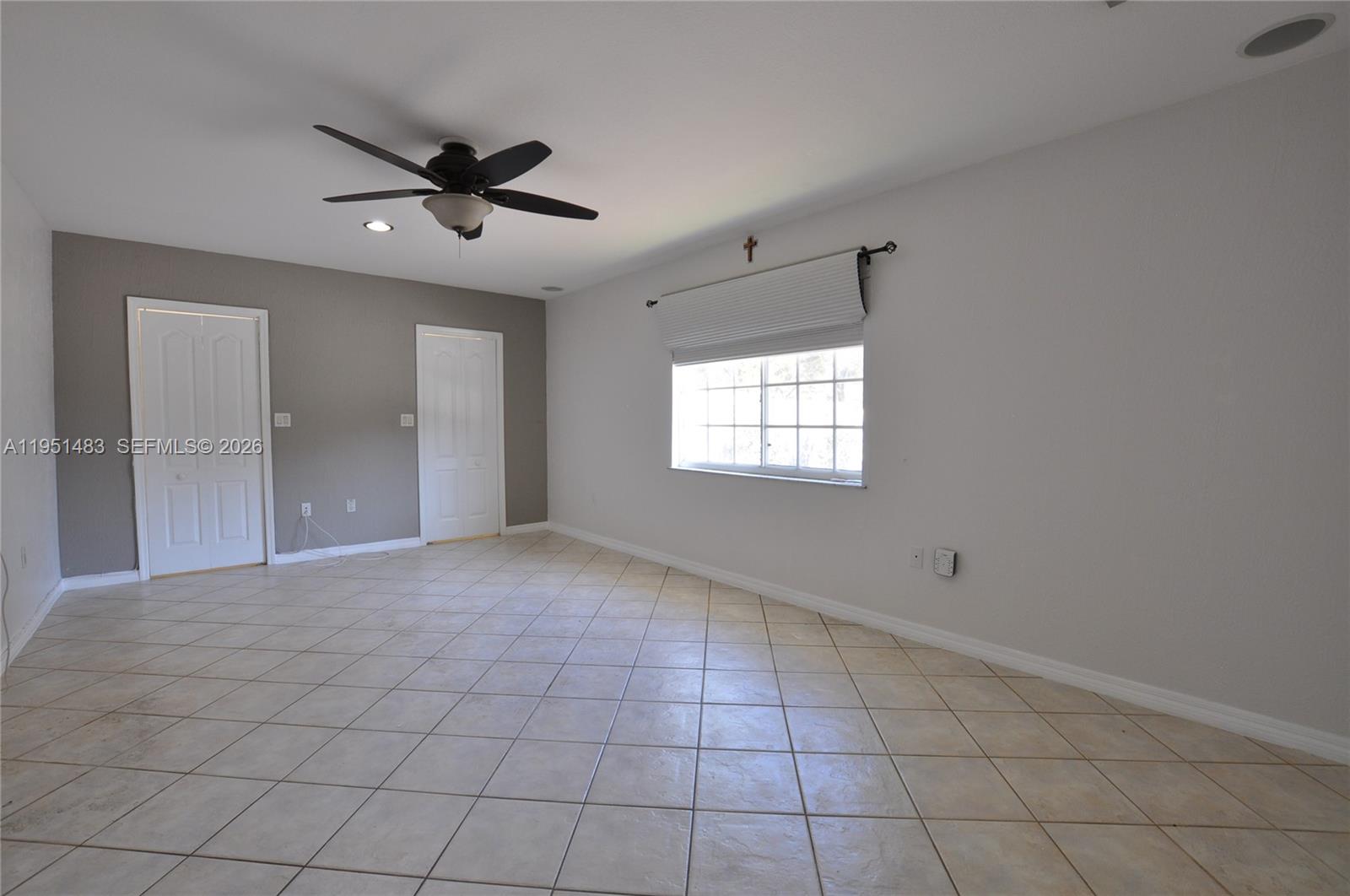 10502 Southwest 77th Court, Unit 10502 Pinecrest, FL 33156 - Photo 18 of 33 a view of an empty room with a window