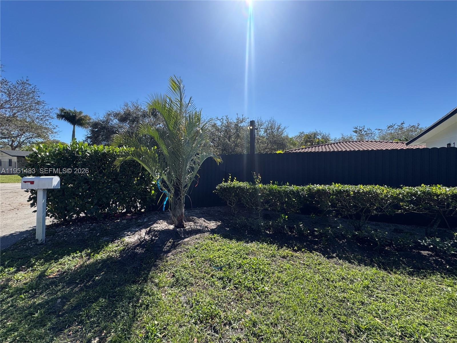 10502 Southwest 77th Court, Unit 10502 Pinecrest, FL 33156 - Photo 33 of 33 a view of a lake with a yard