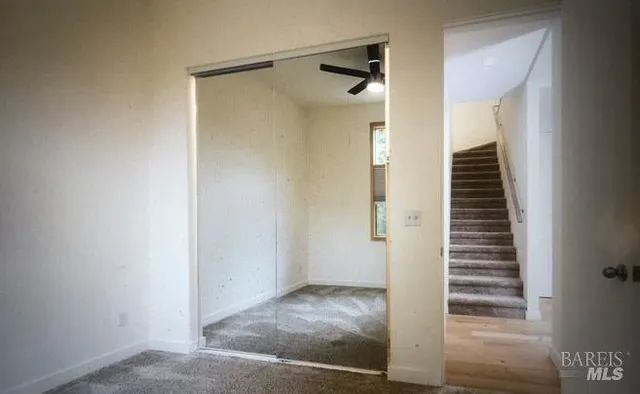 a view of a hallway with staircase