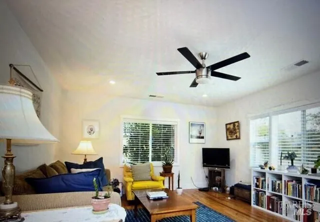 a living room with furniture and a window
