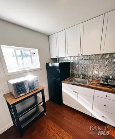 a kitchen with sink cabinets and window