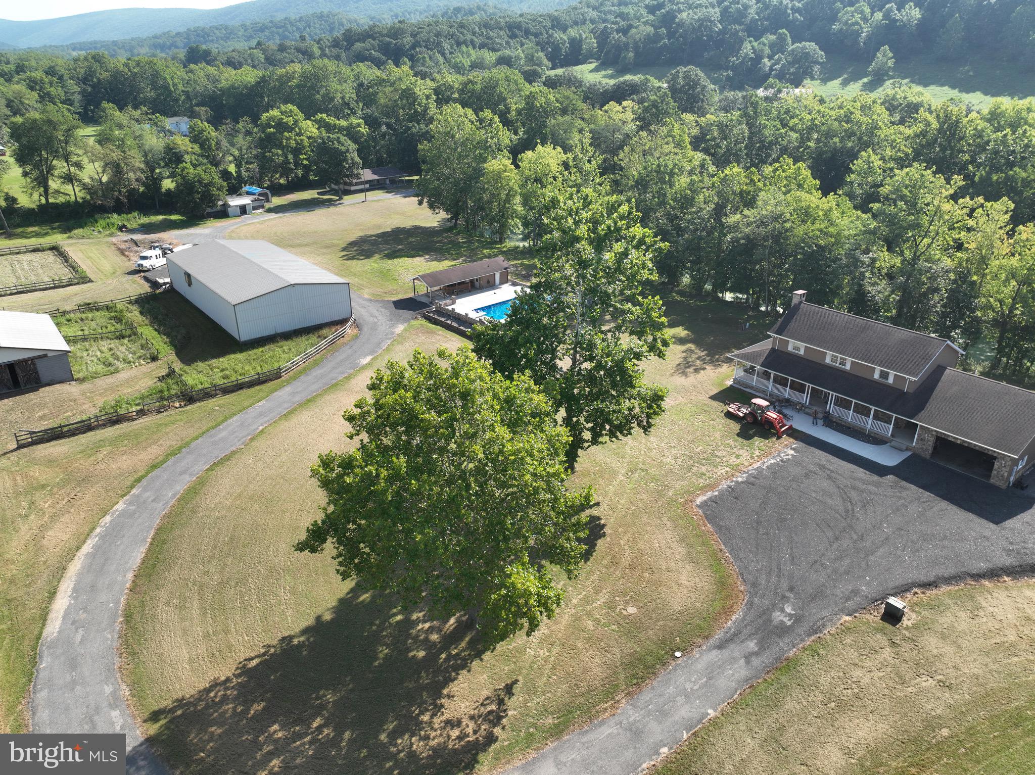 13900 Schellsburg Road Ellerslie, MD 21529 - Photo 14 of 59 an aerial view of a house with a yard basket ball court and outdoor seating