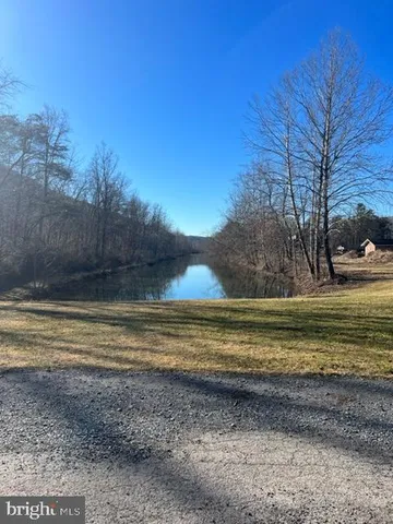 a view of a swimming pool with lounge chairs