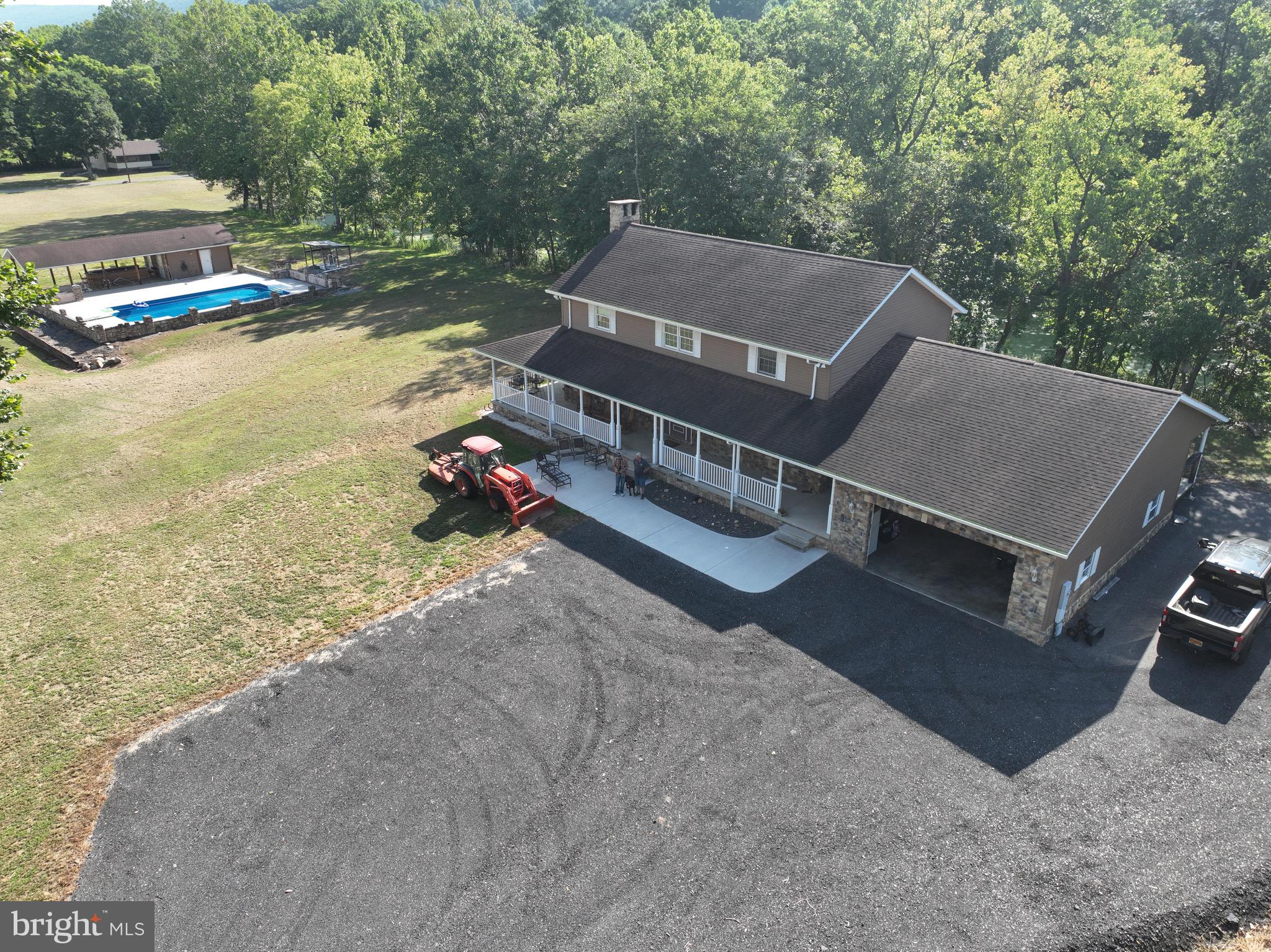 13900 Schellsburg Road Ellerslie, MD 21529 - Photo 2 of 59 a view of a house with pool and yard