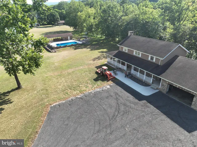 swimming pool view with a outdoor seating