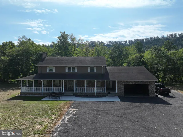 a house with trees in the background