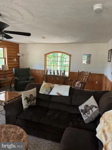 a kitchen with stainless steel appliances wooden floors and wooden cabinets