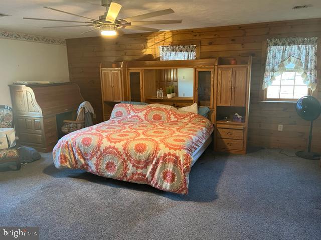 13900 Schellsburg Road Ellerslie, MD 21529 - Photo 38 of 59 a bed sitting in a spacious bedroom next to a window