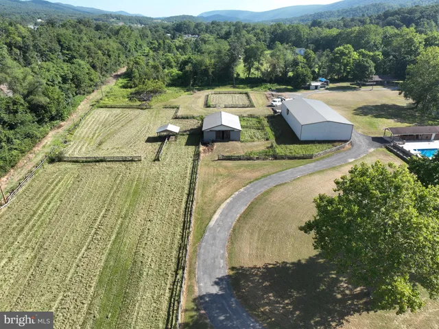 a view of a swimming pool with a yard