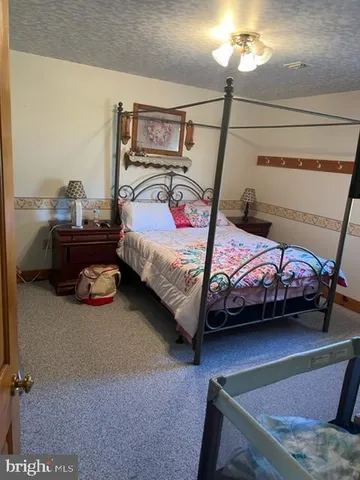 a view of a livingroom with furniture and a flat screen tv