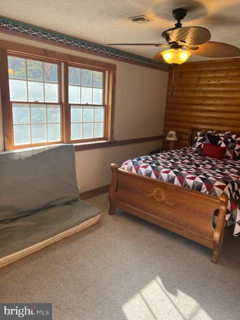 13900 Schellsburg Road Ellerslie, MD 21529 - Photo 44 of 59 a bedroom with a bed and a chandelier