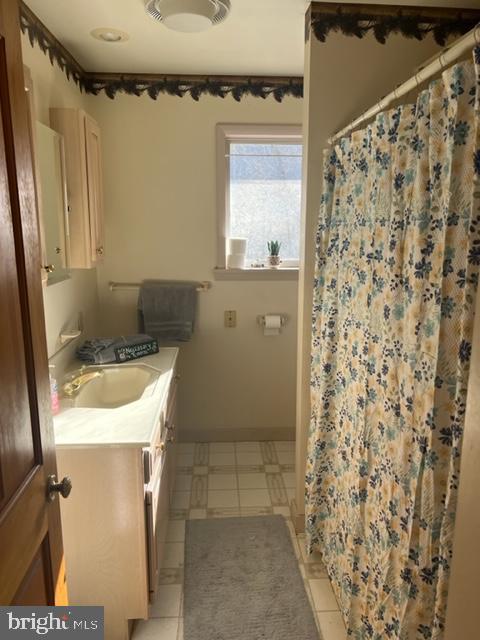 13900 Schellsburg Road Ellerslie, MD 21529 - Photo 45 of 59 a bathroom with a sink and a mirror