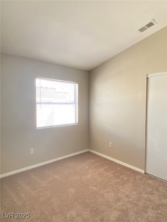 1425 Spice Sky Drive Las Vegas, NV 89128 - Photo 13 of 16 Unfurnished room featuring carpet and baseboards