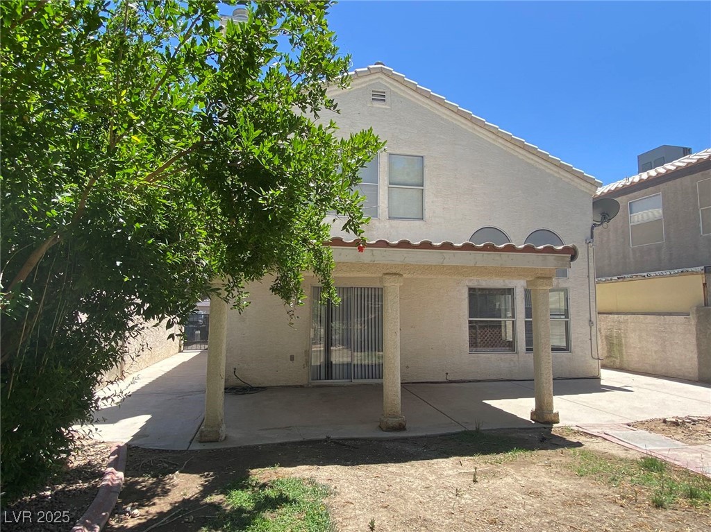 1425 Spice Sky Drive Las Vegas, NV 89128 - Photo 15 of 16 Rear view of property featuring a patio and stucco siding
