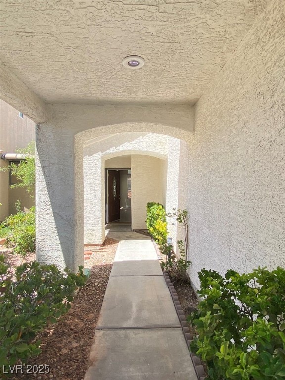 1425 Spice Sky Drive Las Vegas, NV 89128 - Photo 4 of 16 Entrance to property featuring stucco siding