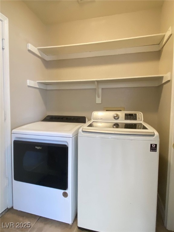 1425 Spice Sky Drive Las Vegas, NV 89128 - Photo 7 of 16 Washroom featuring light tile patterned floors and washing machine and clothes dryer